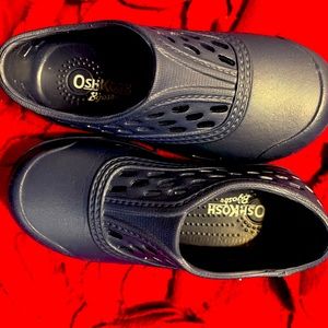 Navy osh-kosh “croc” material slip on sneakers. Size 8 toddler. Never been worn!